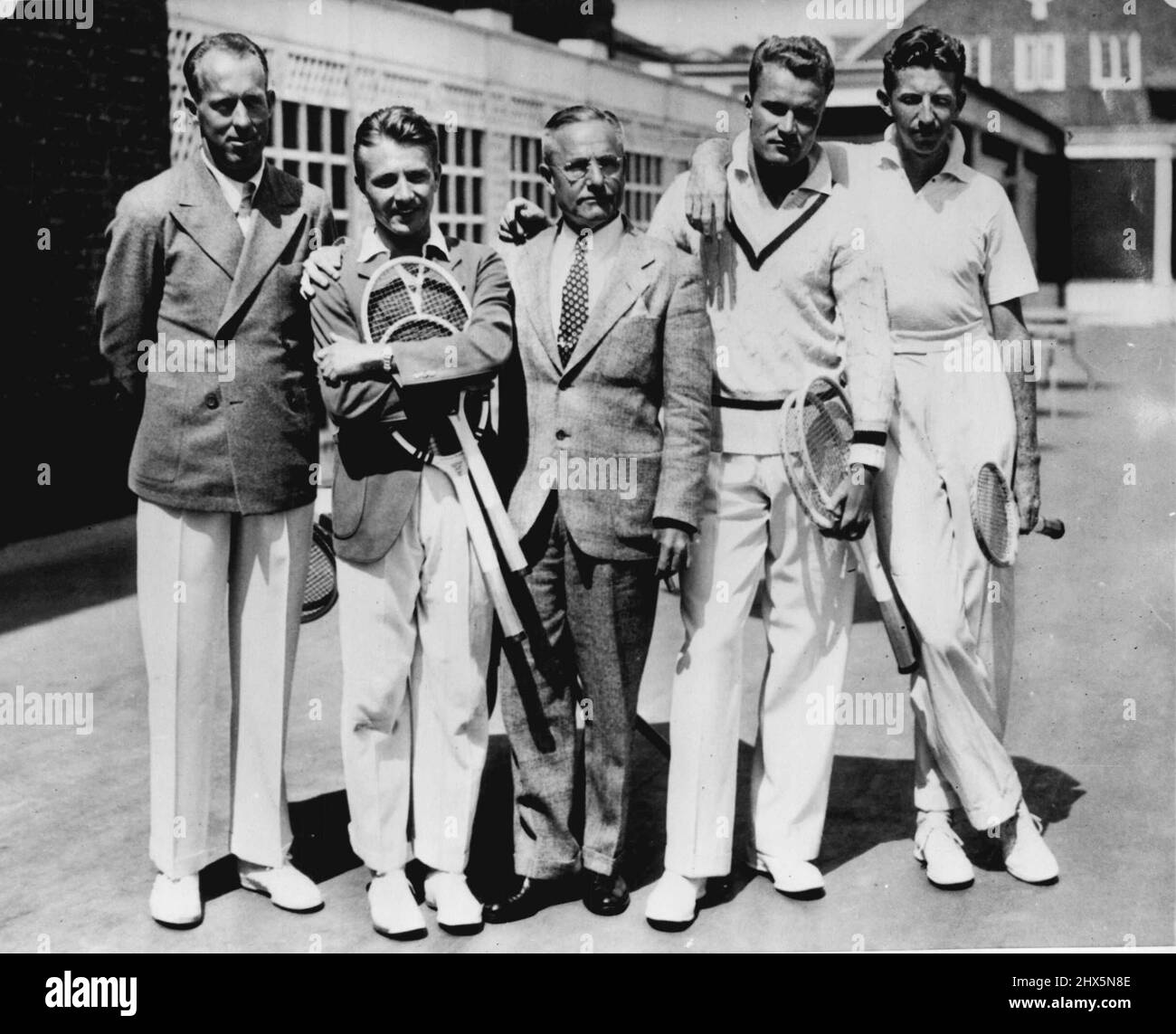 Ready for matches with Australia - With Davis Cup matches set for next week with team from Australia members of U.S. team continued practice here today. Shown during a rest period are (L to R) Wilmer Allison, Bitsy Grant, Walter Pate, non-flying captain; Gene Mako and Don Budge. May 23, 1936. (Photo by Associated Press Photo). Stock Photo