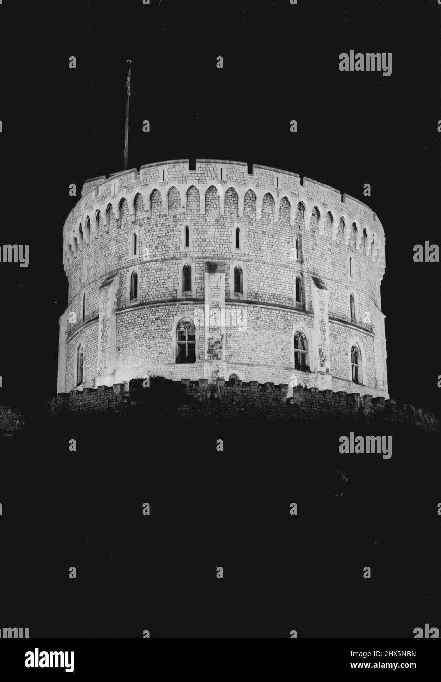 Windsor Castle Floodlit -- How the Round tower appears with the floodlighting of historic Windsor Castle. The lighting test was a try-out for the Festival. April 30, 1951. Stock Photo