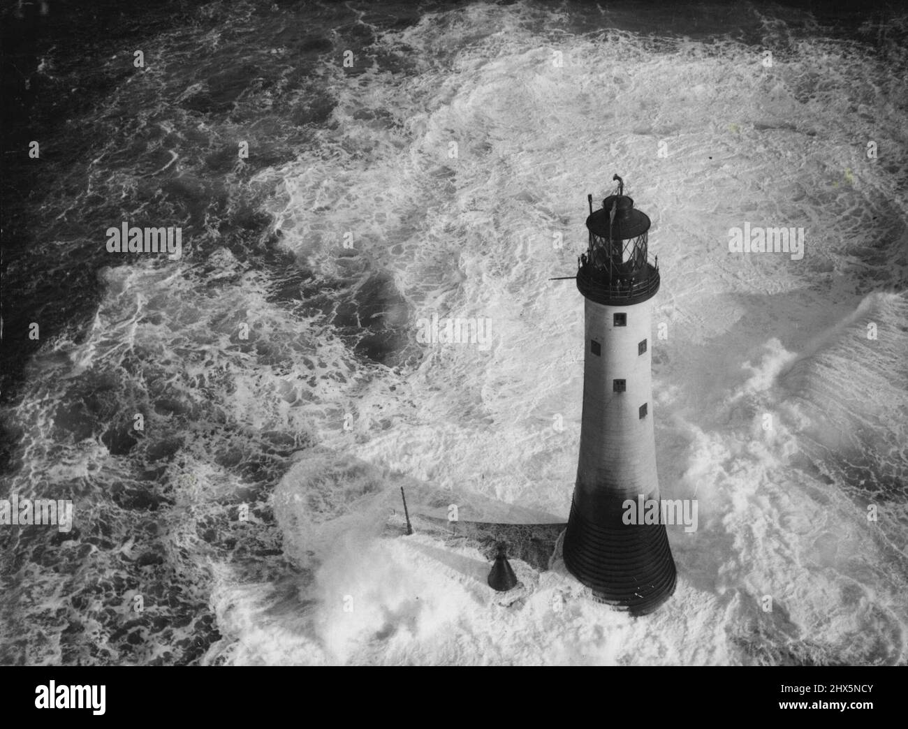 Gales Thwart Desperate Attempt To Relieve Lighthousemen - Heavy seas  breaking around the lonely Wolf Rock Lighthouse off Land's End. Gale-lashed  seas, breaking half- way up the 110-foot tower, defeated attempts by