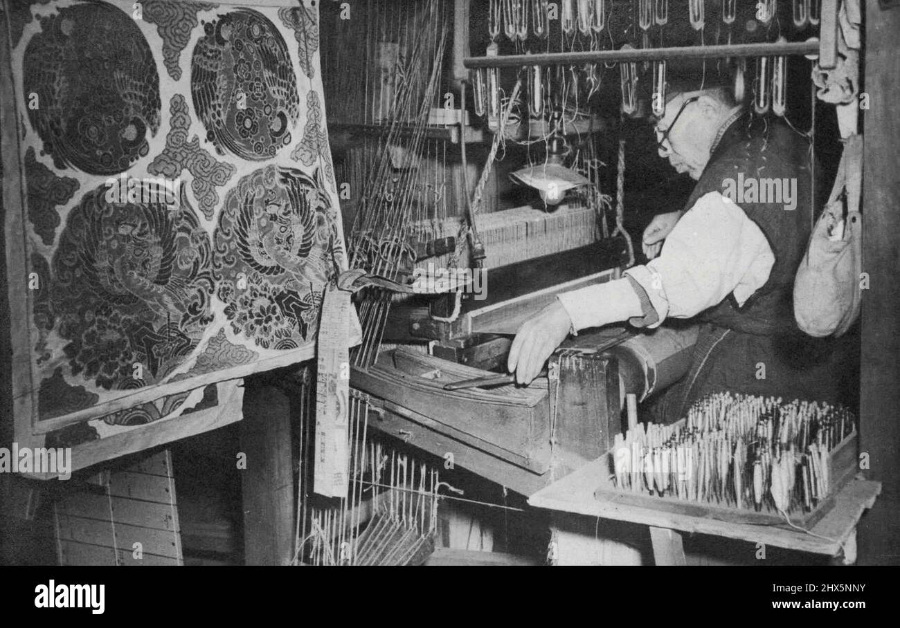 Untouched by War - A Japanese workman is seen in his shop working on an ancient loom, On the left of the picture can be seen some of his finished work. While allied bombs dropped all over The Japanese Island of Honshu, Kyoto, about 230 miles west of Tokyo - experiencing non of The Ruin and ***** caused by Allied attack, continued its ancient silk Industry, ***** one of the oldest of its ***** the city, produces handbags, ***** wall coverings. All are patterned in silk and take on many exquisite oriental designs. November 12, 1945. (Photo by Associated Press Photo). Stock Photo