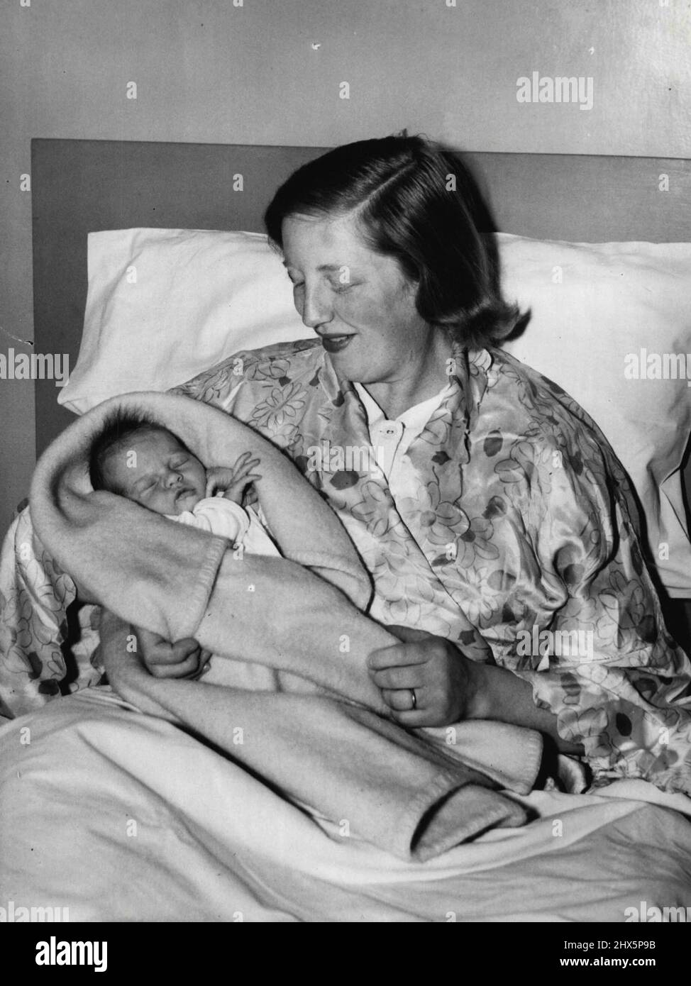 Daughter For Well Known Soprano -- A new and unpublished picture just taken of Mrs. Probyn (Marjorie Shires) with her infant daughter in the nursing home. The birth of a daughter - Linda Judith, was recently announced to Miss Marjorie Shires. One of the principal Sopranos of the sadlers wells opera. She is the wife of Mr. John Probyn, the Australian Baritone, in the company. Miss Shires, who was born in Cheshire, is the daughter of the late Mr. H. Shires and of Mrs. H. Shires of Woodland Avenue, Crewe, Cheshire and her husband Mr. John Probyn is the son of Mr. R. Lee of Sydney, Australia. Stock Photo