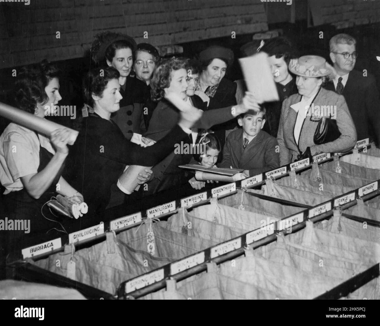 See Mails Sorted. Country women in Sydney for the Country Women's Association conference, visited the GPO to see how their letters and parcels were sorted and sent to them. May 13, 1949. Stock Photo