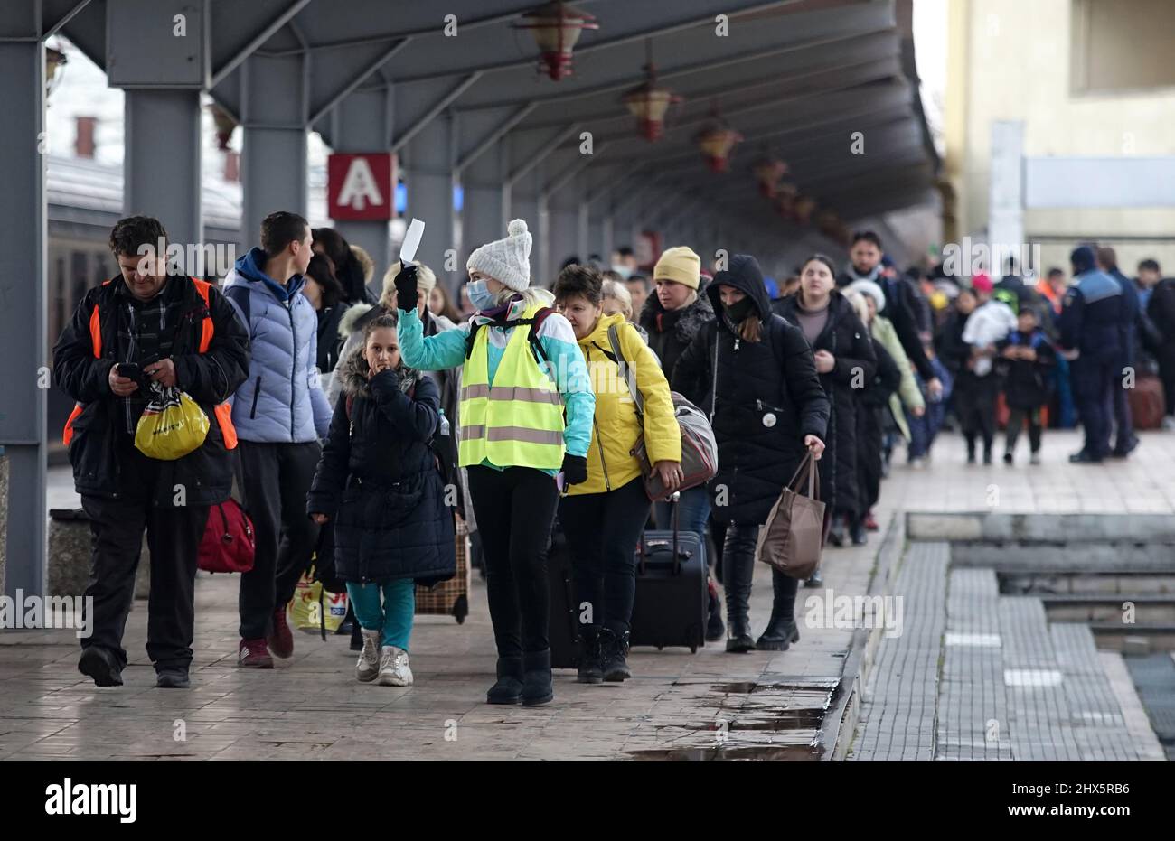 Bucharest, Romania - March 09, 2022: Ukrainian refugees from Ukraine arrived in North Railway Station with a train of 10-car provided by CFR, attempti Stock Photo