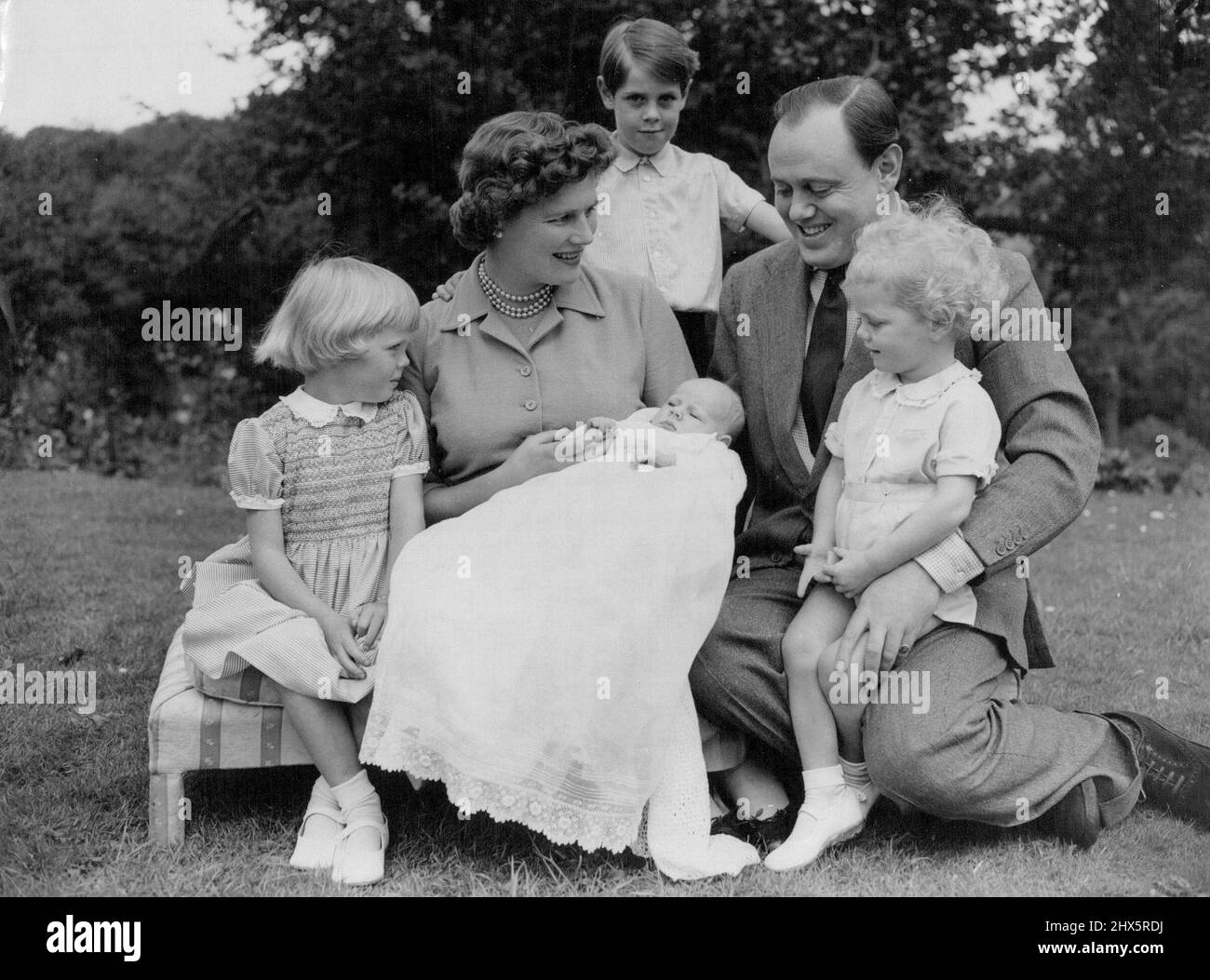 Family Favourite -- Charlotte Clementine, Aged six weeks, month and latest grandchild of British Premier Sir Winston Churchill, holds the firm interest of her own immediate family - mother, Mary Soames, father, Captain Christopher Soames, sister Emma, 4½, and brothers Nicholas, 6½, and Jeremy, 2, at their home at Chartwell Farm, Westerham, Kent. Captain Soames is Member of Parliament for the Bedford Division of Bedfordshire. Mrs. Soames is the daughter of Sir Winston and Lady Churchill. August 25, 1954. (Photo by Reuterphoto). Stock Photo