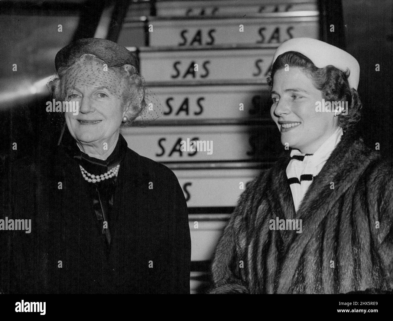 To Receive Sir Winston's Prize -- Lady Churchill (left) and Mrs. Christopher Soames, at London Airport today before their department for Stockholm. Lady Churchill, accompanied by her daughter, Mrs. Christopher Soames, left London today for Stockholm. She is to attend the presentation of Nobel Prize awards and will receive on behalf of her husband, Sir Winston Churchill, the 1953 Literary Prize. December 08, 1953. (Photo by Paul Popper Ltd.). Stock Photo
