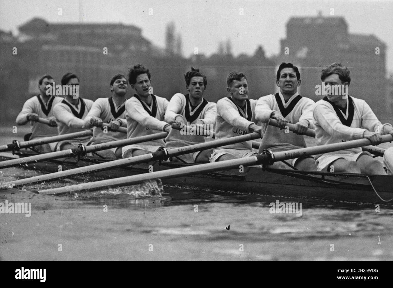 The Boat Race: The Oxford Eight At Work -- A fine action picture as the Oxford eight pull out for a practice spin. L to R: -J.A.Gobbo - bow, (Melbourne Univ.); E.V.Vine (Geelong, Australia.B.N.C.); J.M. Wilson; D.P.Wells; R.D.Rakes; J.G. McCleaod (Sydney Univ.): E.O.G.Pain (Sydney Univ.); G.Sorrel - stroke: and I.A.Watson, the cox. The Oxford University eight have now arrived on the river Thames for their final training in readiness for the annual Boat Race against their Cambridge University rivals. March 9, 1955. (Photo by Sport & General Press Agency Ltd.). Stock Photo