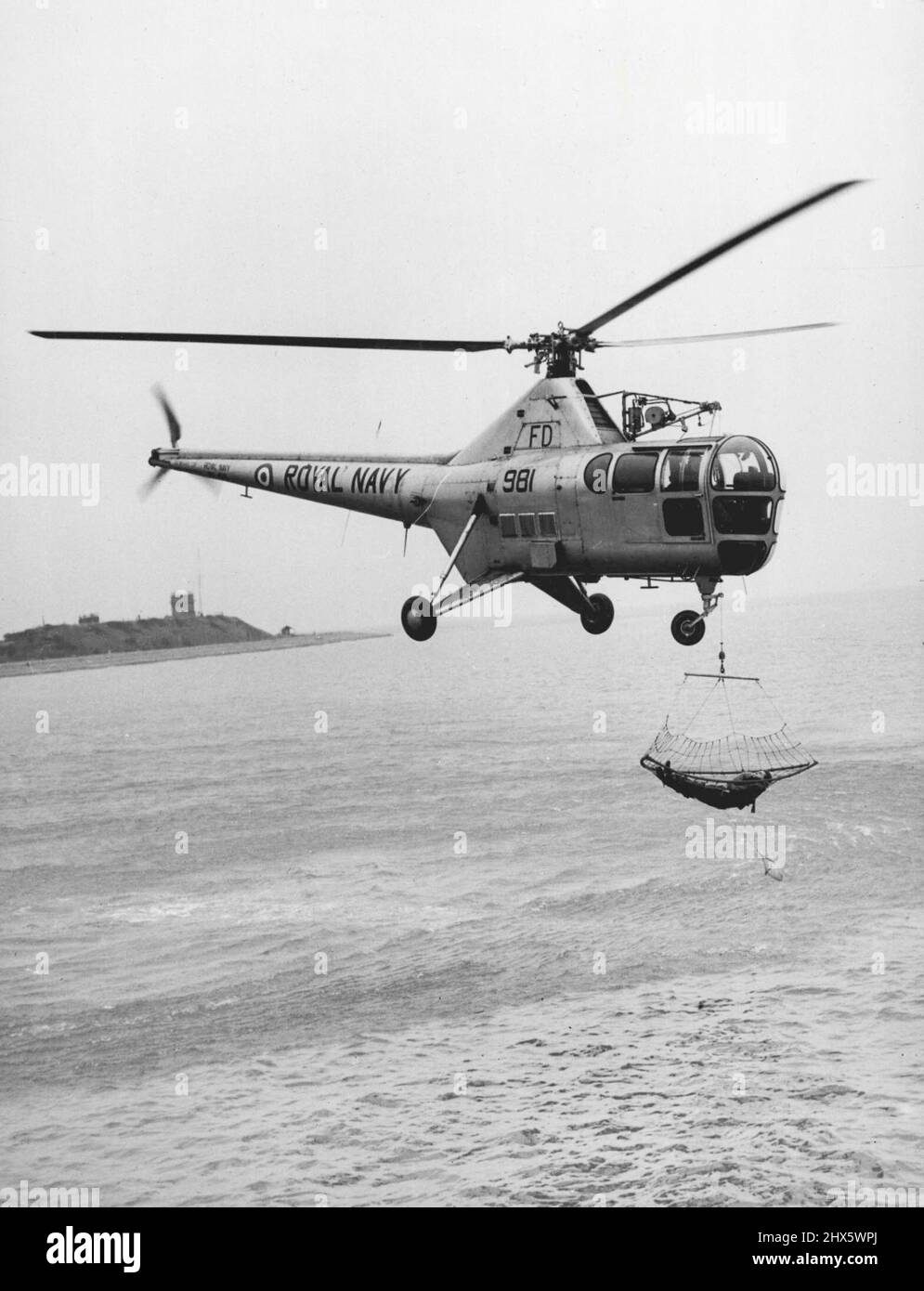 Demonstrating The Navy New Rescue Net A "Victim" is scooped out of