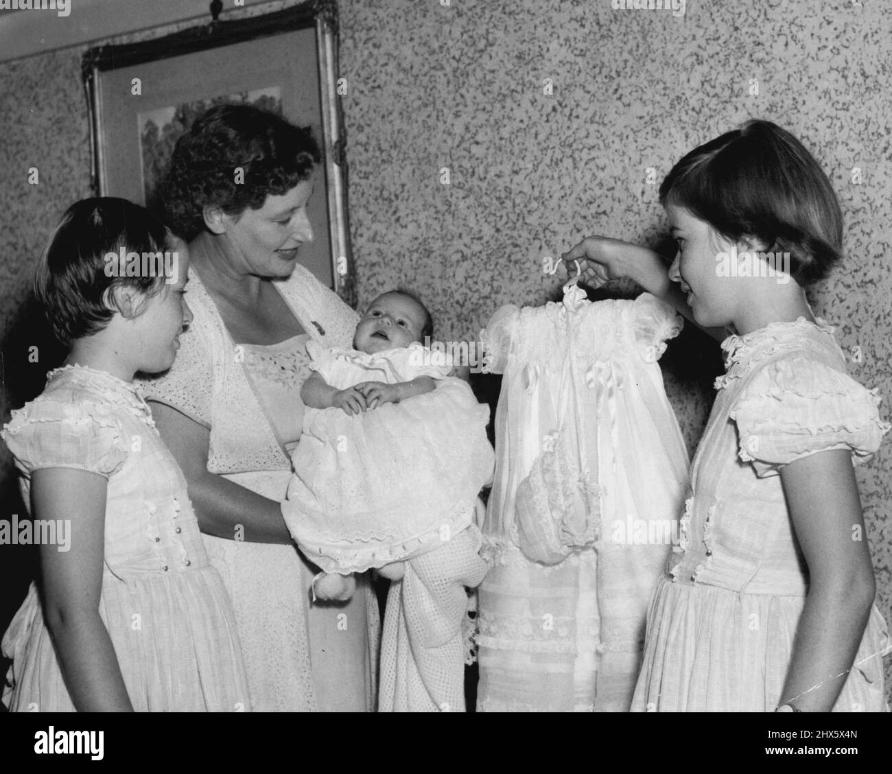 Beatrice Ann and Rosalind wanted to dress Mary Jane. March 18, 1955. Stock Photo