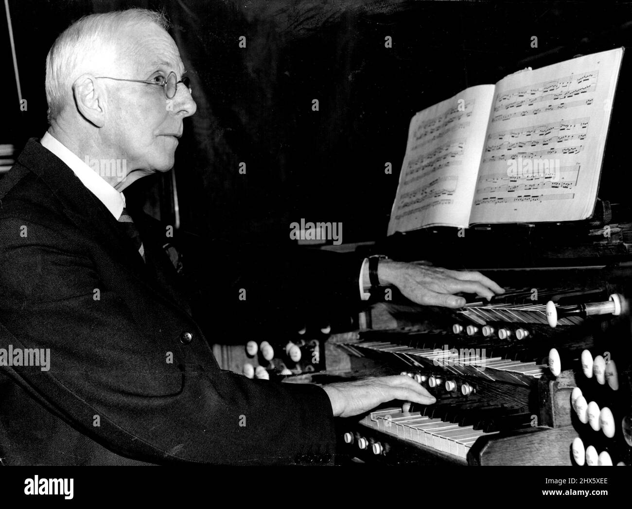 Organist For 50 Years At St. James' Church -- St. James' Church, King Street, organist, Mr. George Allman, who is celebrating 50 years association with the church, at the Console of the church organ last night. A man who has probably been to more weddings than any other person in Australia is ***** Organist At St. James' Church, King Street.He is Mr. George Faunce Allman, 74 who began his career in the accountancy section of a Sydney Shipping Company. January 15, 1955. Stock Photo