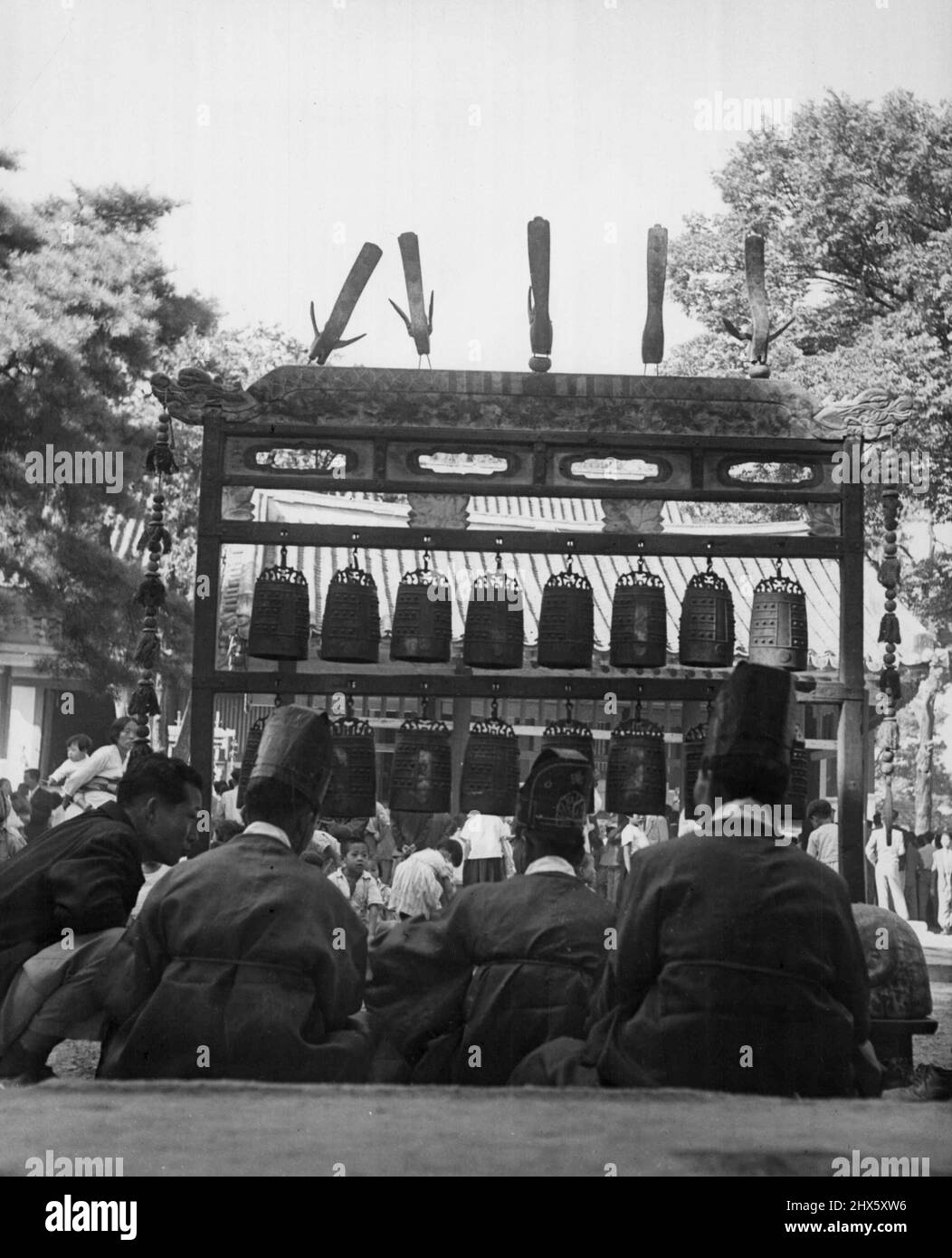In Hour Of Confucius (Fourth Of Six) -- Another kind of musical instrument, the 'Bells,' are played at the entrance to the Chufu Temple, which is named for the birthplace of Confucius in Shantung Province, China. October 16, 1953. (Photo by United Press).;In Hour Of Confucius (Fourth Of Six) -- Another kind of musical instrument, the 'Bells,' are played at the entrance to the Chufu Temple, which is named for the birthplace of Confucius in Shantung Province, China. Stock Photo