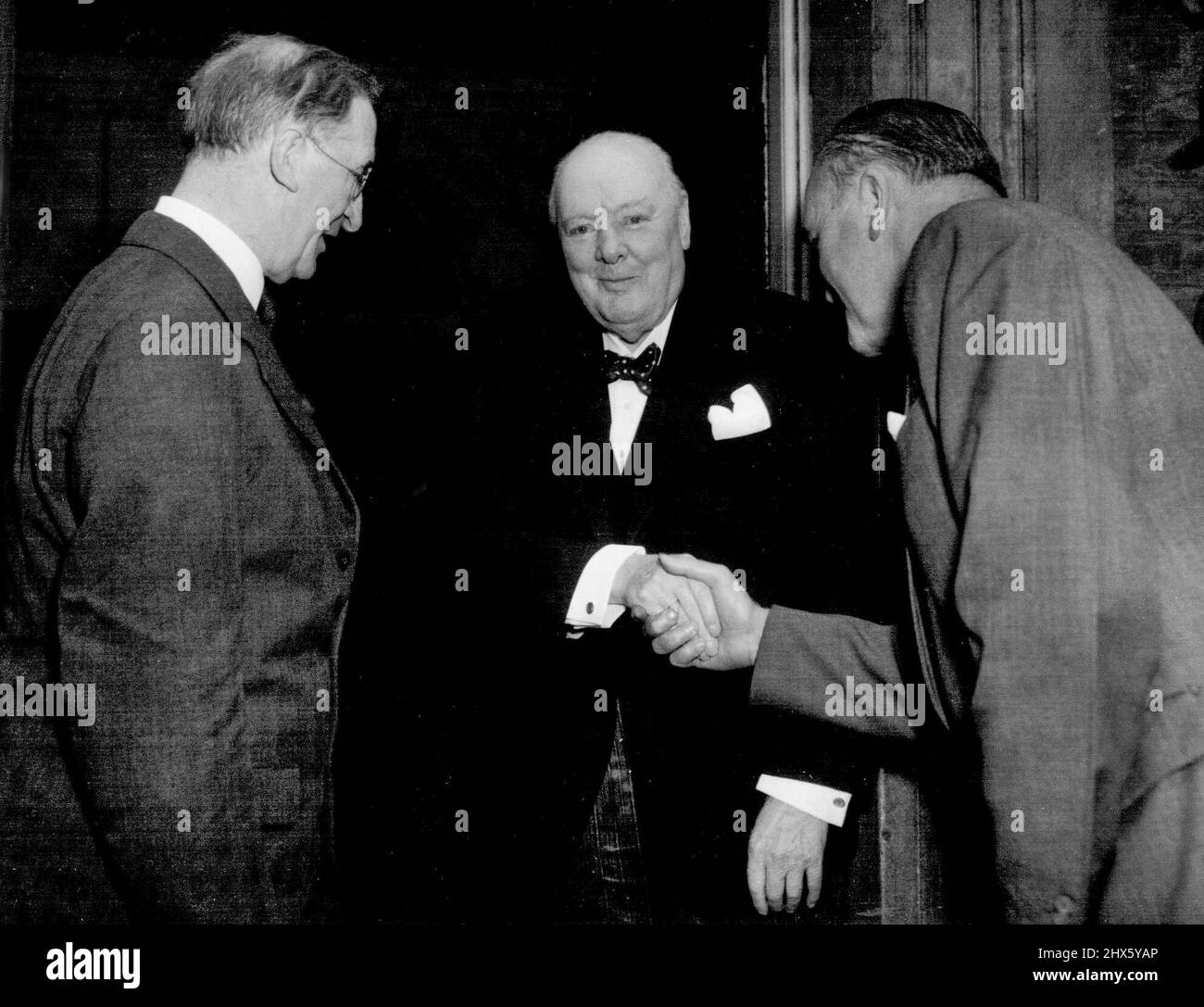 De Valera Lunches With Sir Winston Irish Prime Minister Eamon de Valera lunched with British Prime Minister, Sir Winston Churchill at number ten Downing street today September 16th. Sir Winston Churchill (centre), greets Eamon de Valera (left), and Frank Aiken the Irish Foreign Minister (right), as they arrived at number ten downing street for lunch today September. November 01, 1953. (Photo by Associated Press Photo).;De Valera Lunches With Sir Winston Irish Prime Minister Eamon de Valera lunch Stock Photo