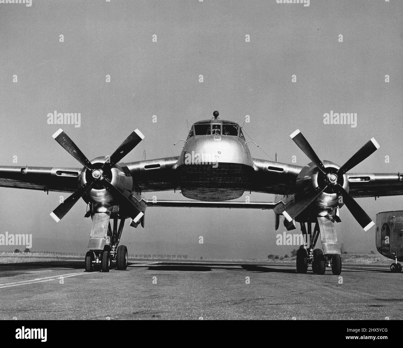 Minus its cargo-carrying detachable fuselage, the new Fairchild XC-120 Packplane taxis easily on its specially-designed quad- ricycle landing gear. The cargo compartment fits beneath the plane, held in place by four centrally-placed connections. October 01, 1950. (Photo by Dan Frankforter, Fairchild Aircraft).;Minus its cargo-carrying detachable fuselage, the new Fairchild XC-120 Packplane taxis easily on its specially-designed quad- ricycle landing gear. The cargo compartment fits beneath the p Stock Photo