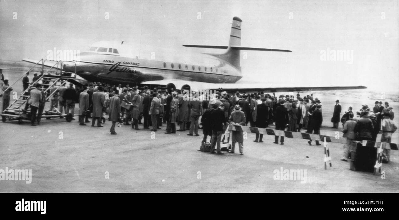 New Yorkers Inspect Canadian Jet Engine -- The Avro Jetliner, Canadian-built jet airliner, attracts a crowd at international airport here today after completing a 365-mile flight from Toronto, Canada, in one hour. The 60-passenger plane resembles an ordinary plane except for its absence of propellers. There are two jet engines on each wing. The plane bore gifts and invitations on behalf of the Canadian International Trade Fair at Toronto May 29-June 9. April 18, 1950. (Photo by AP Wirephoto).;Ne Stock Photo