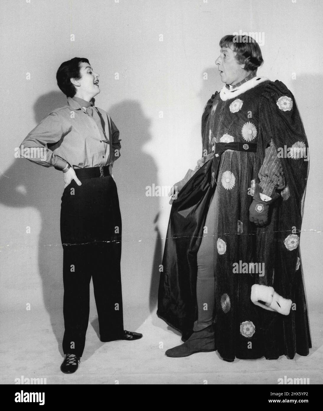 Sir Cedric and Lady Hardwicke. 22, Lady Hardwicke has fun at the sight of Sir Cedric's tights which he wears as Edward IV in Sir Laurence Oliver's production of Richard III at Shepperton Studios. December 21, 1954. (Photo by Jack Esten).;Sir Cedric and Lady Hardwicke. 22, Lady Hardwicke has fun at the sight of Sir Cedric's tights which he wears as Edward IV in Sir Laurence Oliver's production of Richard III at Shepperton Studios. Stock Photo