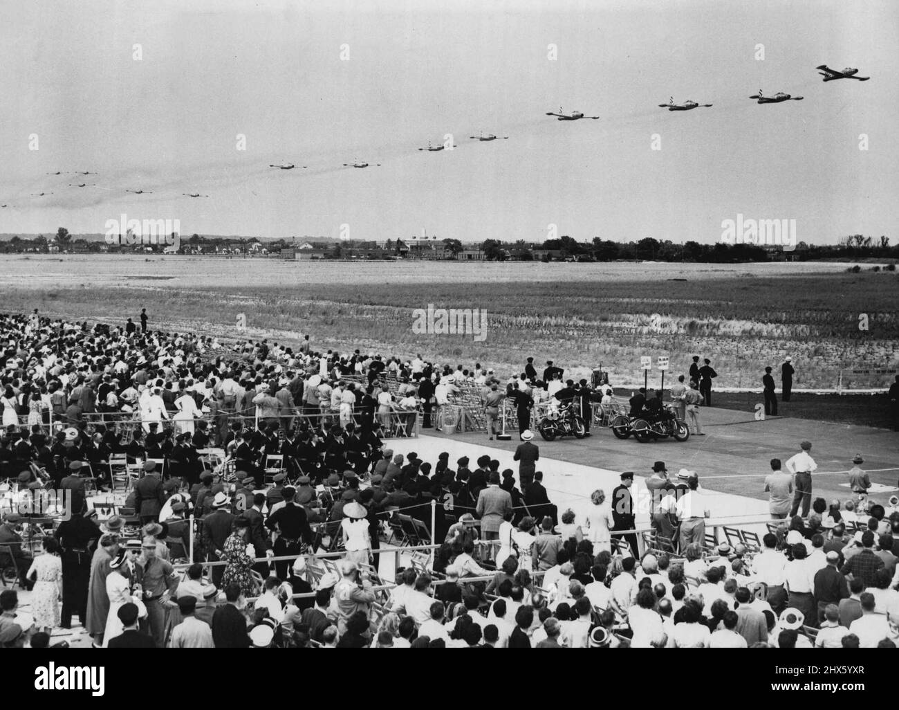 Thunderjets Over Idlewild -- A Squadron of F-84 Thunderjets flies in formation over the New York International Airport at Idlewild, N.Y., Aug. 7. They are from the 14th Fighter Group which is based in Bangor, Me. They flew to New York for the International Air Exposition which celebrates the opening of the 4,900-acre airport. August 07, 1948. (Photo by Associated Press Photo).;Thunderjets Over Idlewild -- A Squadron of F-84 Thunderjets flies in formation over the New York International Airport a Stock Photo