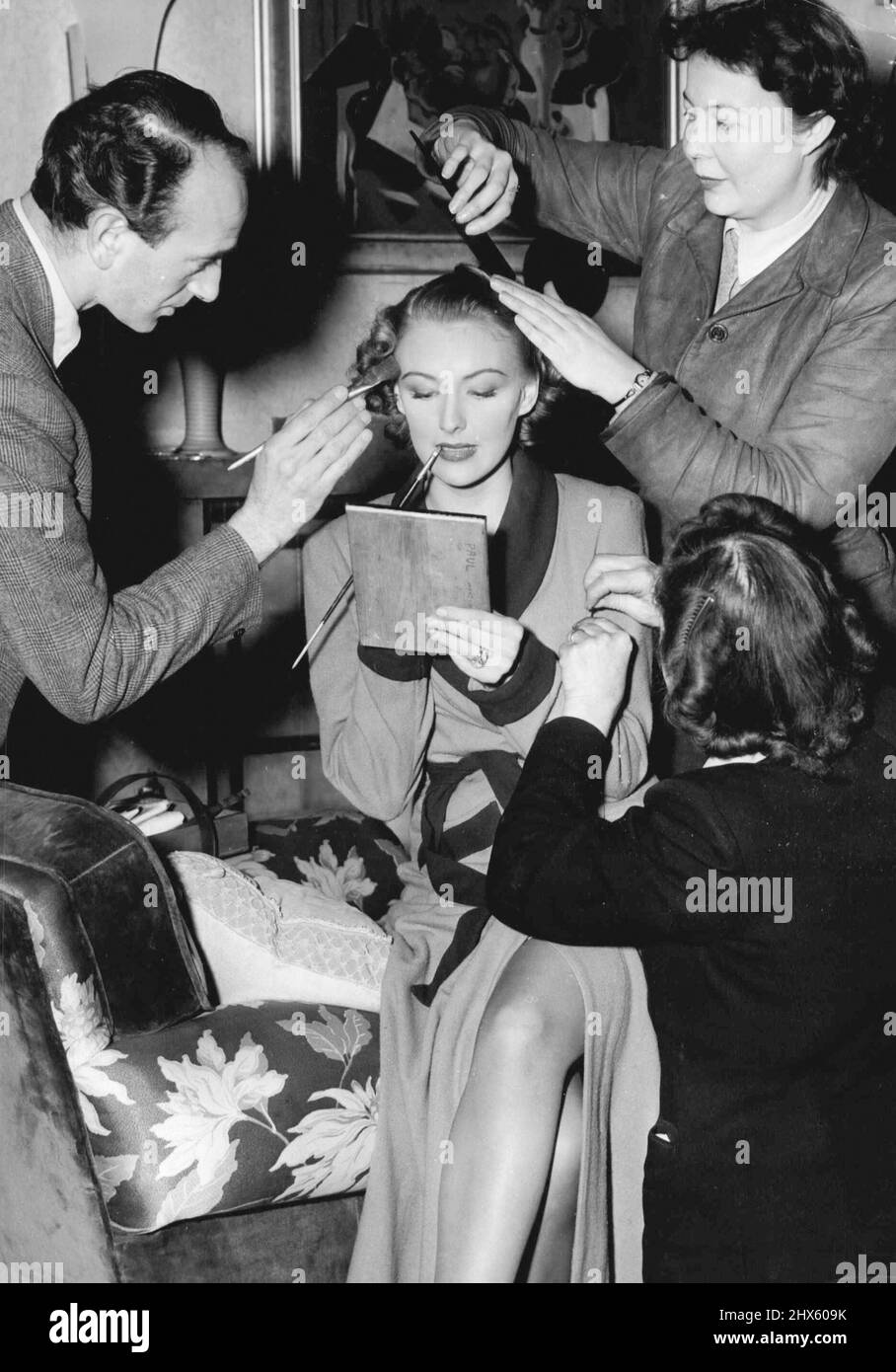 Hair dressing, wardrobe and make-up get to work on Susan Shaw before a  scene in Waterfront - While Susan herself puts final touches to her lips.  Paul Soskin's independent production Waterfront, stars