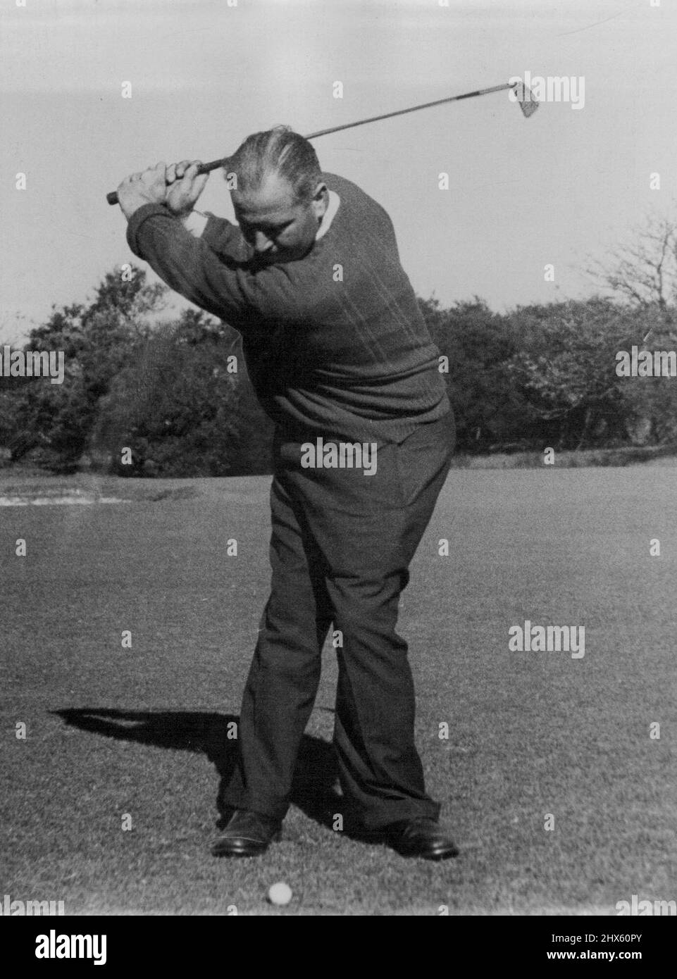 Magic eye camera shows Adams, at start of the down swing Body is fully pivoted against braced right leg. September 29, 1952;Magic eye camera shows Adams, at start of the down swing Body is fully pivoted against braced right leg. Stock Photo