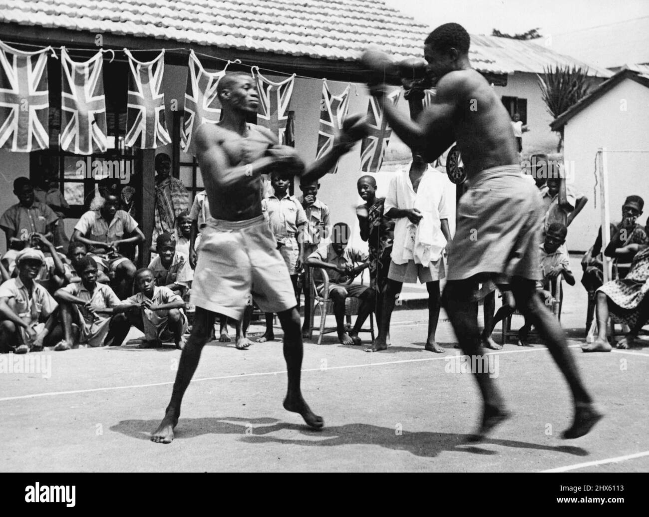 African Community Centre -- Boxing is the most popular of sports; any tournament is certain of the patronage of young and old. Classes are held three times a week. September 7, 1951. (Photo by British Official Photograph).;African Community Centre -- Boxing is the most popular of sports; any tournament is certain of the patronage of young and old. Classes are held three times a week. Stock Photo