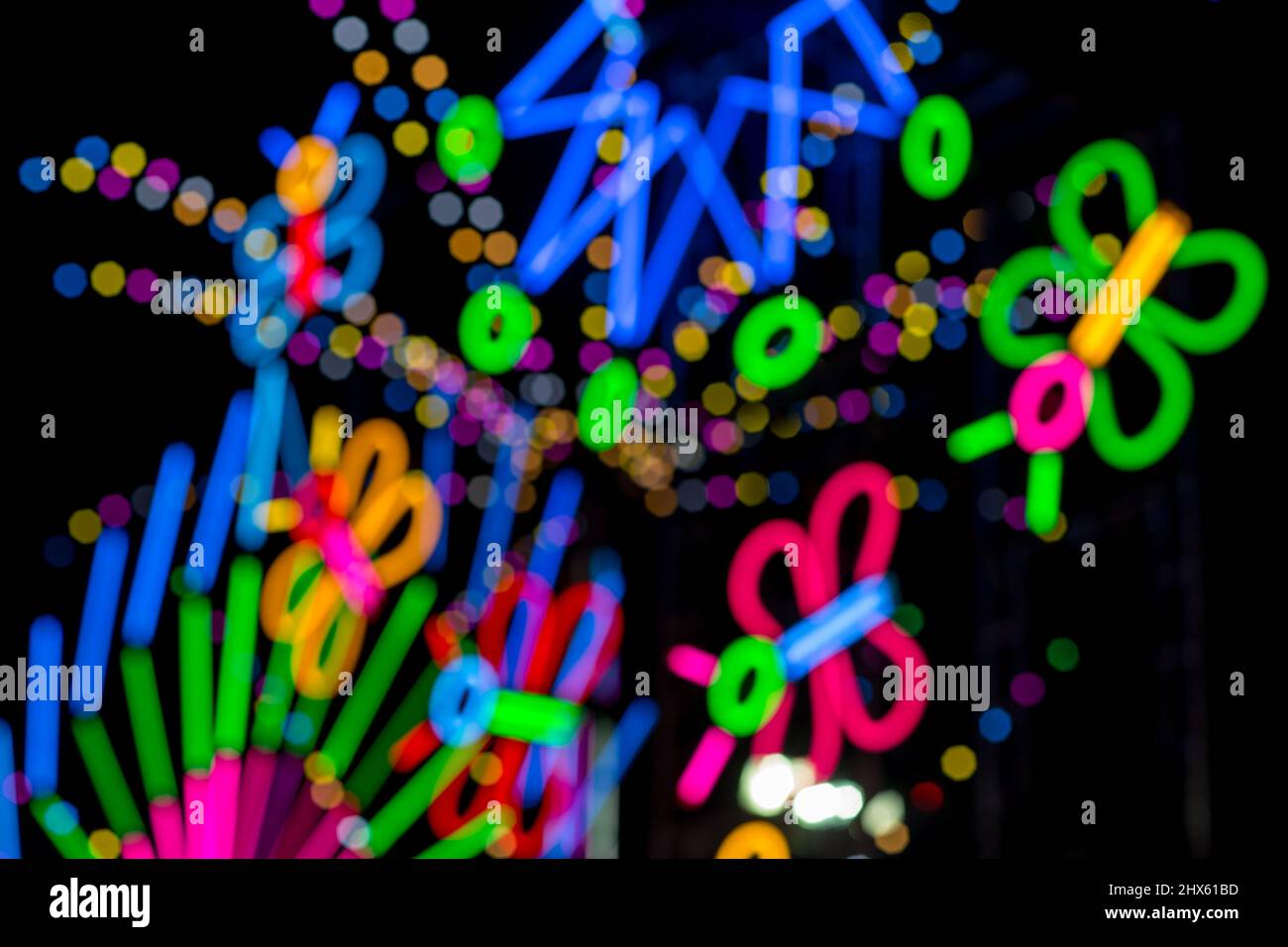 Blured Multi-colored neon lights at night. Stock Photo