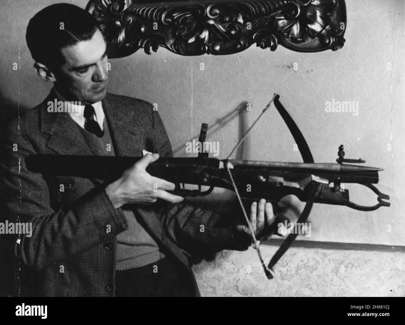 Clive Amadio, with collection Antique weapons. September 3, 1945.;Clive Amadio, with collection Antique weapons. Stock Photo
