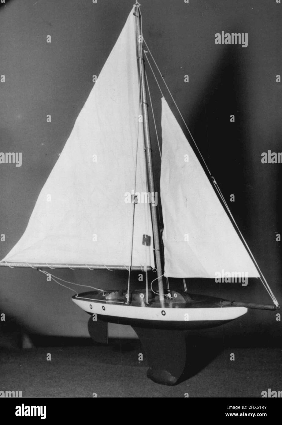 Model yacht is what most small boys want for Christmas. This one is £5/16/11. December 8, 1953. Stock Photo