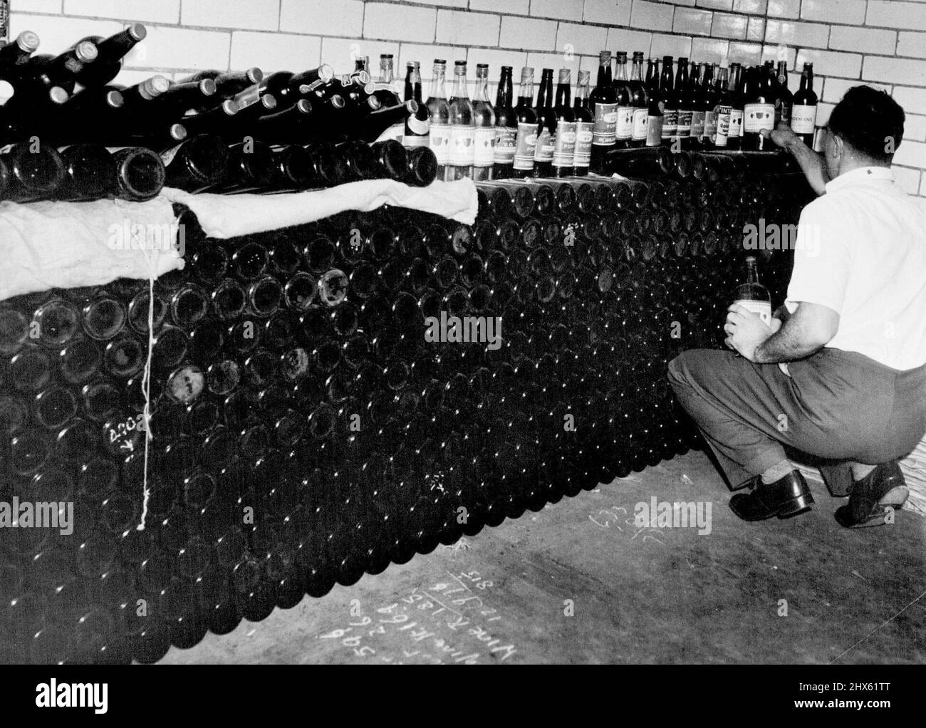 Taken by a Redfern police in a raid on a shed in Baptist St. Redfern picture shows large ***** of 976 bottles of ***** include a art. January 22, 1945.;Taken by a Redfern police in a raid on a shed in Baptist St. Redfern picture shows large ***** of 976 bottles of ***** include a art. Stock Photo
