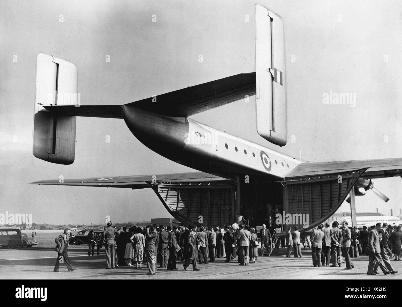 Flying Display And Exhibition Opens Today At Farnborough Aerodrome, Hants - Crowd queueing up to inspect the Blackburn General Aircraft Ltd. Prototype Beverley, a freighter, at the Exhibition today. Large crowds today attended the 1953 Flying Display and exhibition, showing the products of the Members of the Society of British Aircraft Constructors, which opened today at Farnborough Aerodrome, Hants. September 07, 1953. (Photo by Fox Photos). Stock Photo