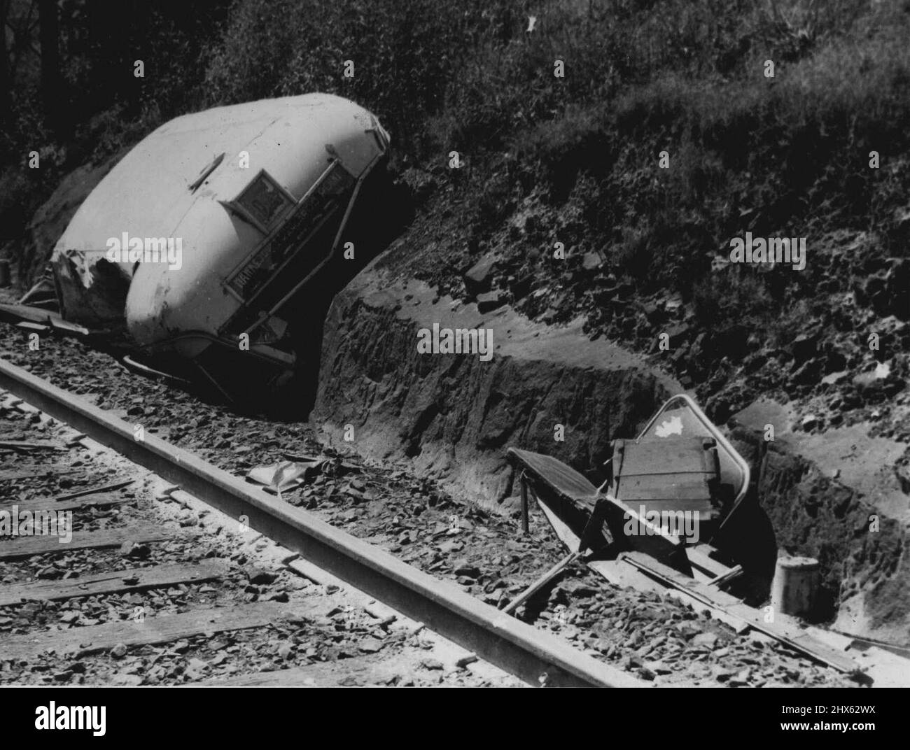 Tragic Level- Crossing smash at Hawkesbury River, NSW., when the Kempsey mail crashed into a bus at Hawkesbury River, NSW, on January 20, the roof of the bus, carved off as though with a knife, was hurled alongside the track two hundred yards from the scene of accident. January 25, 1944. (Photo by Associated Newspapers Ltd.). Stock Photo