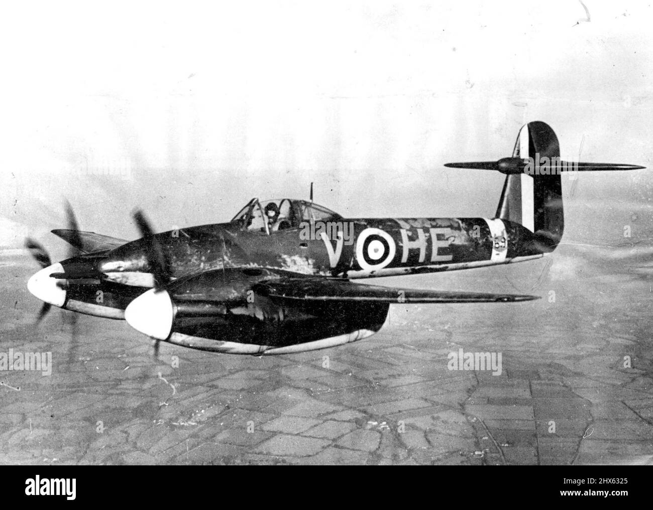 Westland ***** Photograph showing the Westland ***** engined single seater Monoplane Fighter new operating with the R.A.F. It is fitted with two Rolls Royce 'Peregrine' engines, each of 850 h.p., and its armament consists of four 20m.m. cannons mounted in the pose. The span is 45ft. length 32 ft. 3ins. and height 10ft. Gins. An interesting feature is the tail unit, the tail planes being placed well above the line of the fuselage and set in the high fin towards its upper extremity. September 10, Stock Photo