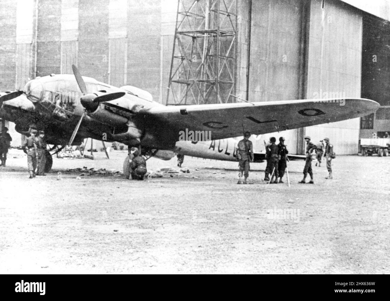 German Bomber Captured Intact. American soldiers are shown examining a German Heinkel H-3 bomber which was taken intact in the capture of an airport in North Africa. April 13, 1943. (Photo by ACME Photo). Stock Photo