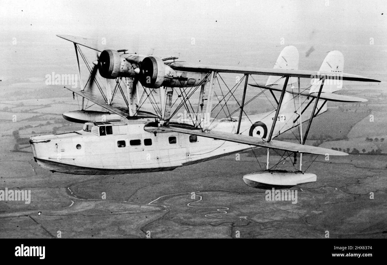 The Fastest Twin-Engined British Military Flying Boat. Passes Stiff Tests. A very impressive picture of the 'Stranraer' in flight over the R.A.F. Station at Felixstowe. A new flying boat designed by Supermarine and known as the 'Stranraer' has just completed its trials. It is of biplane design, all metal construction, it has two Bristol- Pegasus engines, and can fly with one of these out of action, and its chief feature is the extraordinary comfortable and spacious quarters provided for the crew Stock Photo