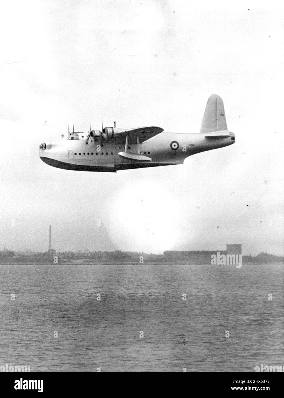 Britain's New Flying Battleship. Overall clean lines and four 1,000 h.p. Bristol Pegasus engines with three-blade variable pitch airs crews unite to give the new Sunderland flying boat high speed and long range - up to 3,000 miles. This aircraft is a military version of the Short flying boats which operate the main Empire air services, and is to re-equip R.A.F. sea-duty units. It is formidably armed, and has gun turrets fore and aft. June 2, 1938. Stock Photo
