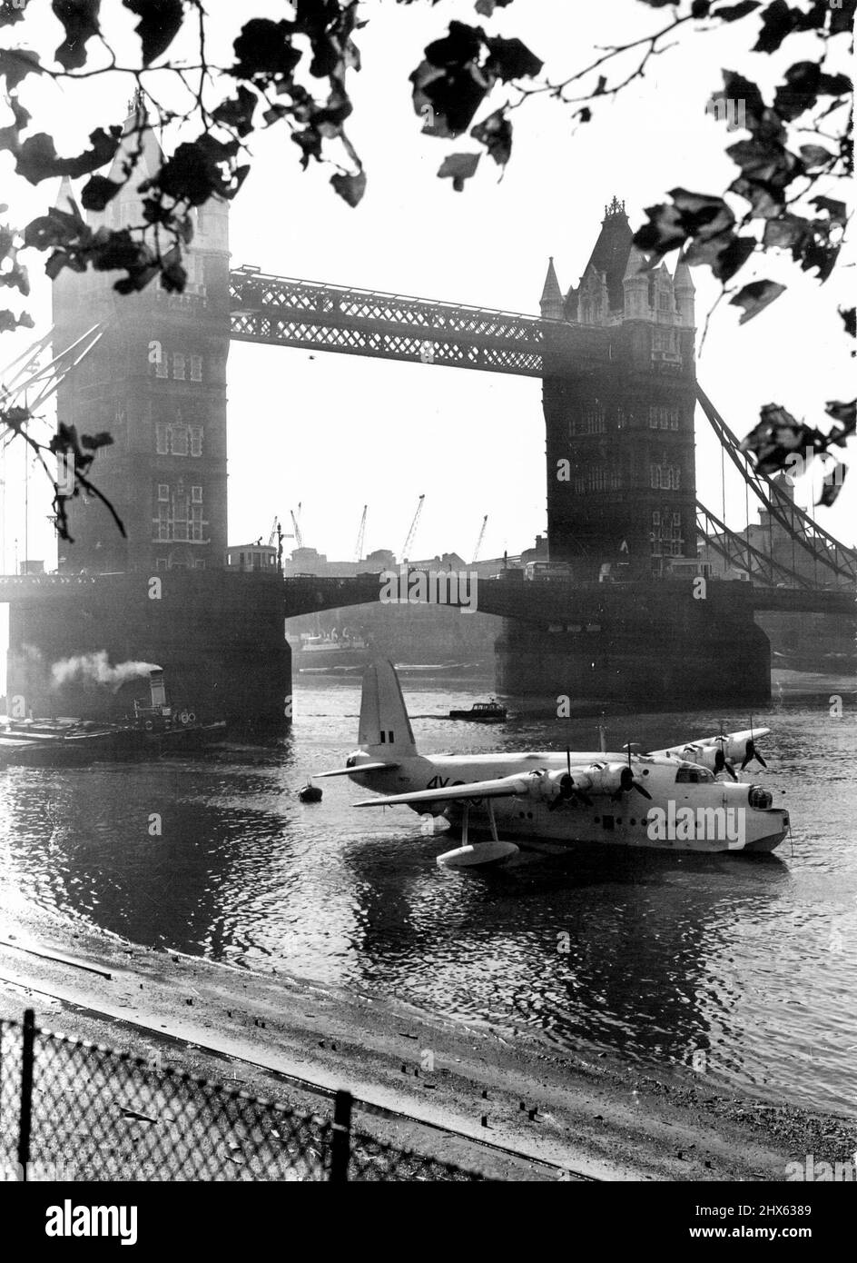 Thames Has Strange Visitor - For Battle of Britain Week. Strange visitor to the River Thames is this Sunderland Flying Boat, seen here against a background of the Tower Bridge, which has been moored here for the Battle of Britain week - the tenth anniversary of the victory of 'The Few' ever the German Luftwaffe. Celebrations and displays by the Royal Air Force are being held all over the country during this week. September 12, 1950. Stock Photo