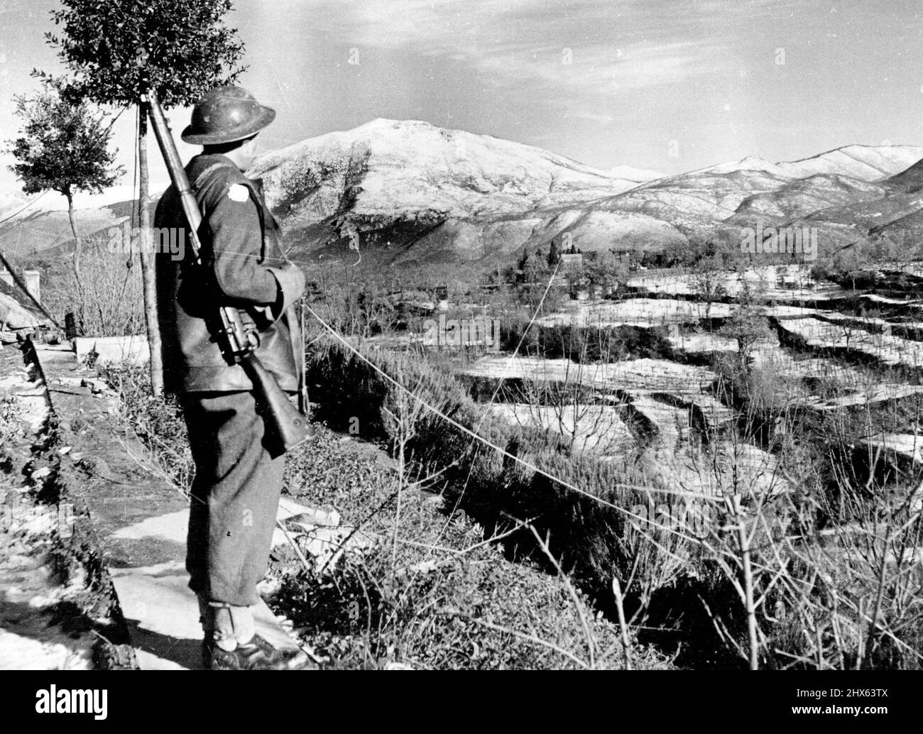 Fifth Army Fights "General Weather" Driver C.A. Langford, R.A.S.O., of Boston, Lincs., looks