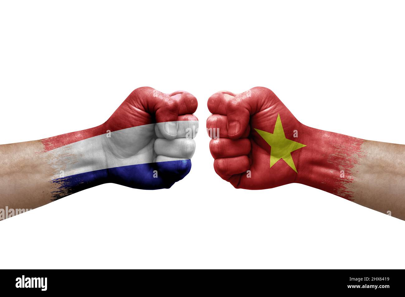 Two hands punch to each others on white background. Country flags painted fists, conflict crisis concept between netherlands and vietnam Stock Photo