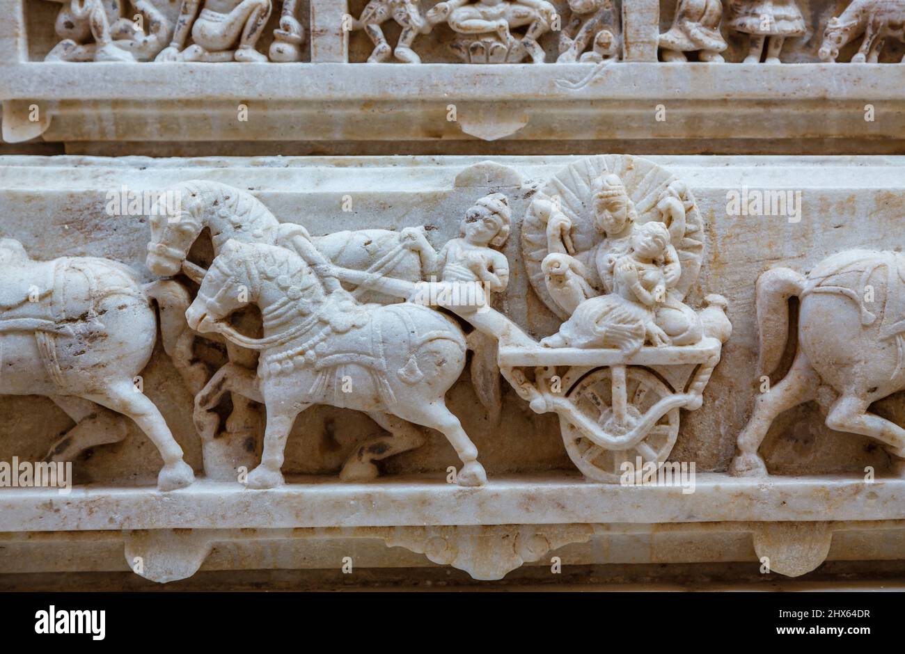 Horses and chariot sculptured frieze at the Hindu Shree Jagat Sheromani Ji Temple, Udaipur, Indian state of Rajasthan, India Stock Photo