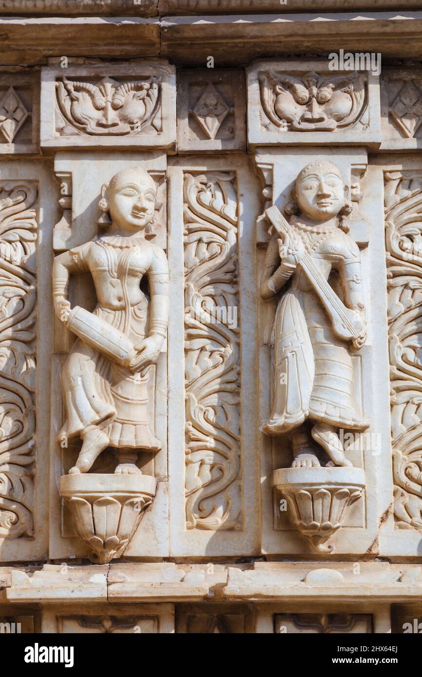 Wall carvings of female figures with musical instruments in the Hindu Shree Jagat Sheromani Ji Temple, Jagdish Chowk, Udaipur, Rajasthan, India Stock Photo