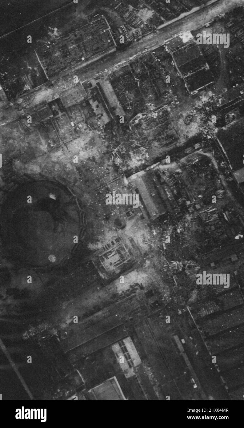 R.A.F. Bomb Paris Works 3/3/42. After The Raid -- Aircraft of the R.A.F. flew over the works at a low altitude on the following day and secured this close-up of the damage. The area marked a in guide picture shows damaged Gasometer and buildings: below and to the right of the Gasometer are damaged tanks and damaged tank assembly shops. August 23, 1942. (Photo by British Official Photograph). Stock Photo