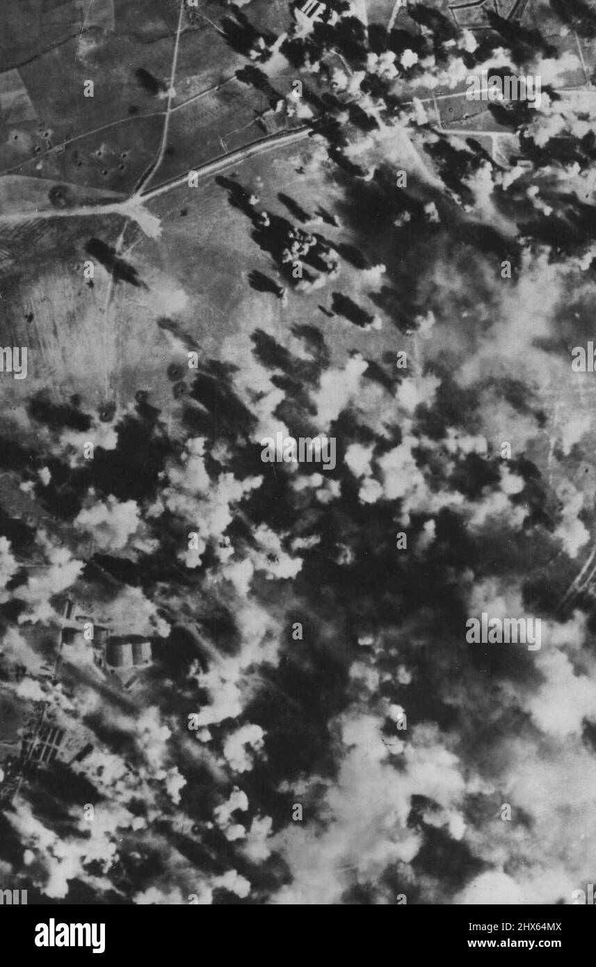 U.S. Bombers Blast German Airfield In France The German Montpellier Airfield in Southeastern France is nearly covered by bomb bursts during a concentrated attack by Flying Fortresses of the 15th U.S. Army Air Force. Warehouses, repair shops and hangars were damaged during the raid. April 21, 1944. (Photo by War Office of Information Picture). Stock Photo