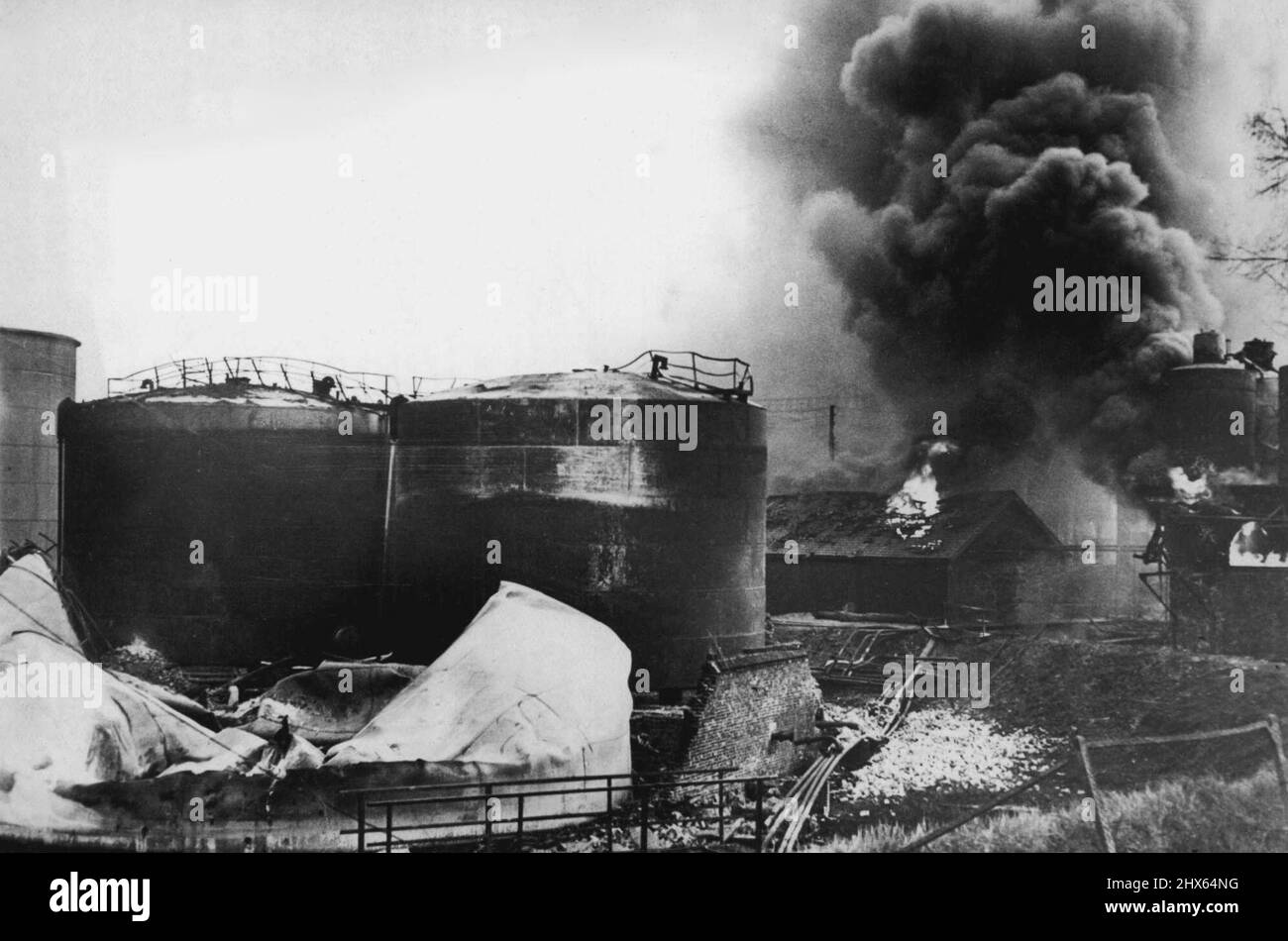 Creat Fuel Tank Blaze This picture arriving from France today shows huge petrol tanks blazing furiously. May 25, 1940. (Photo by Keystone). Stock Photo