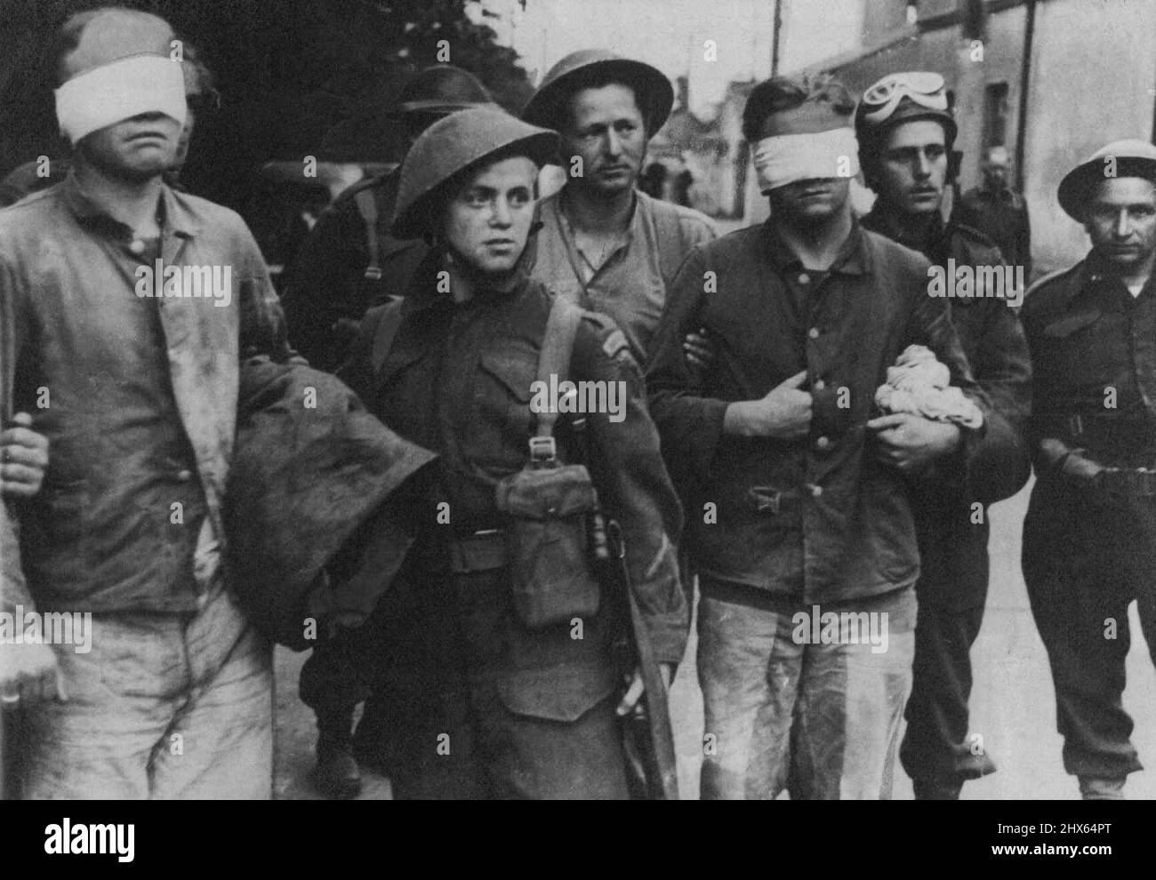 Blind folded sees rule prisoners taken by British ***** England. October 4, 1942. (Photo by Keystone Press Agency Ltd.). Stock Photo