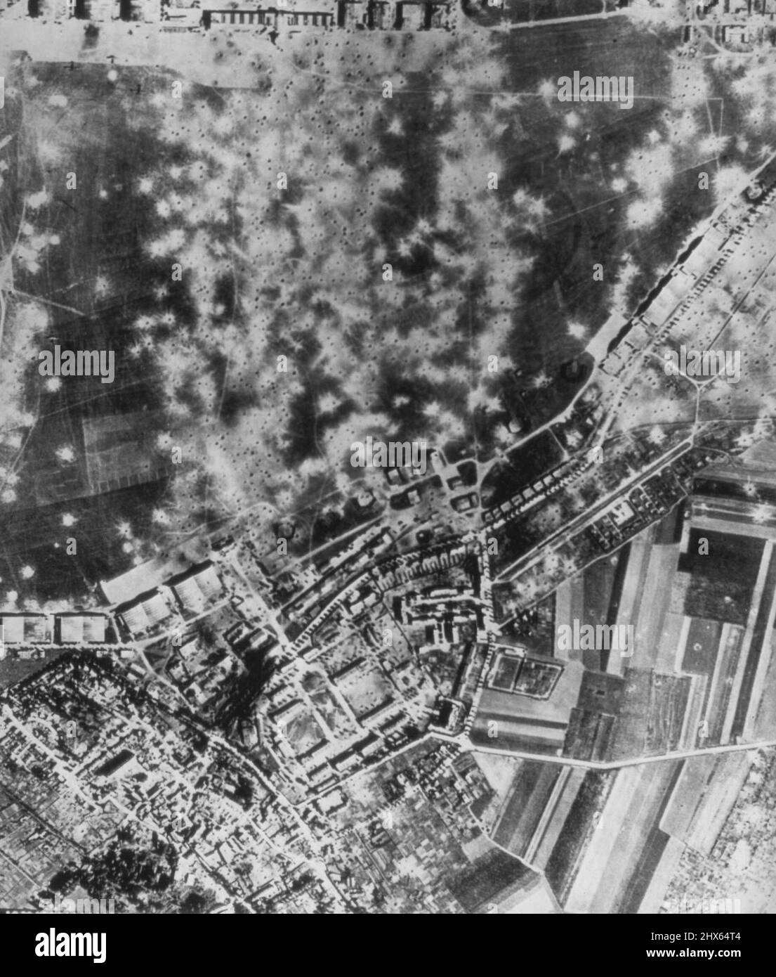 One Way To Ground Enemy Planes -- This picture of Le Bourget airfield at Paris shows one method flying fortresses based in England use to ground German Planes. It's simply just blast the field and the buildings about it full of holes. This was the result of a recent attack. Today with Allied Forces swarming into Italy, the greatest fleet of American and British bombers ever hurled across the channel pounded enemy ports and airfields in Northern France. September 9, 1943. (Photo by AP Wirephoto). Stock Photo