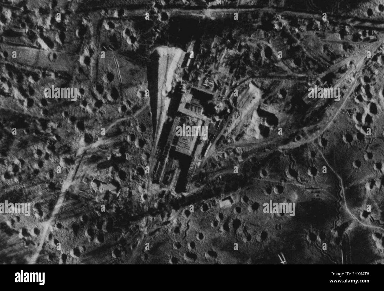 Liberation of Europe. Allied Bombers Attack Pas De Calais Target This picture is one of a series showing the results of Allied air-attacks on a large constructional works in the Pas De Calais area similar to the large site recently captured in the Cherbourg Peninsular. The target consisted of a large concrete structure and a number of ancillary buildings probably associated with it. These and other similar sites have been attacked form time to time by aircraft of R.A.F. Bomber Command and U.S. Stock Photo