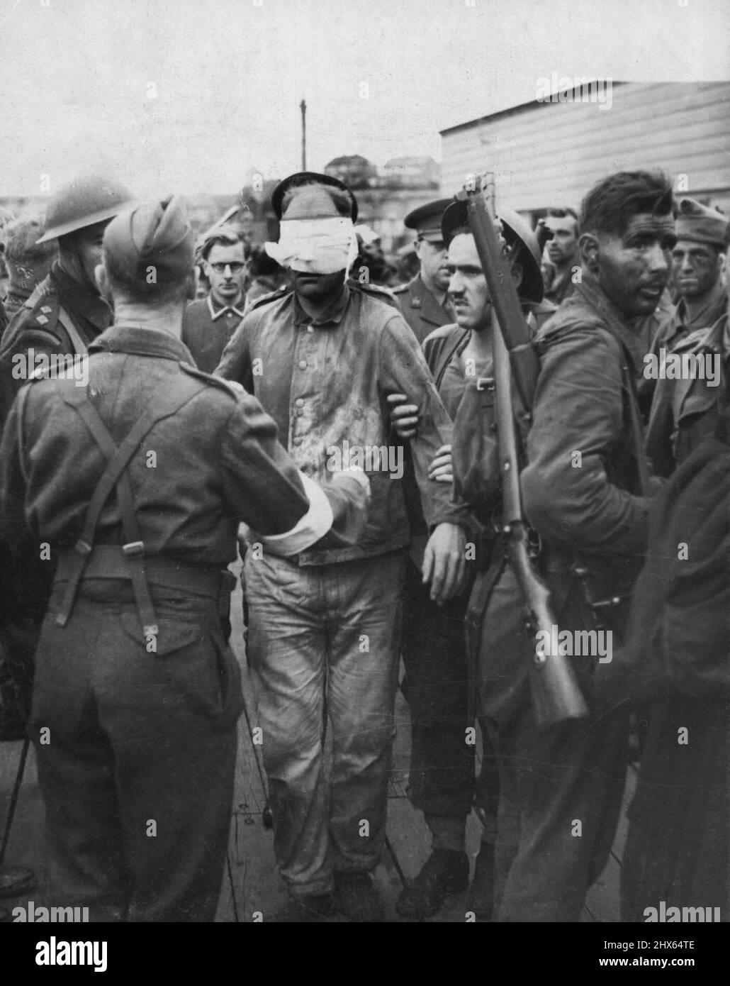 German prisoner being landed in England after Dieppe raid. October 11, 1942. (Photo by Sport & General Press Agency, Limited). Stock Photo