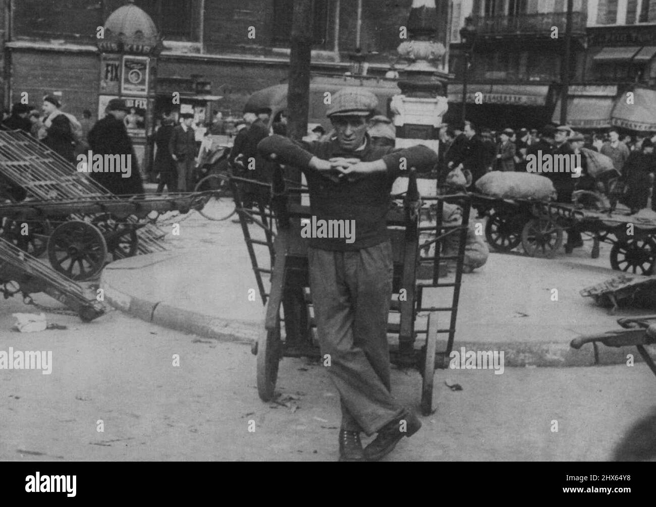 Paris under Two Years Nazi Rule -- Les Halles, The Covent Garden of Paris, was formerly full of vegetables, fruits and all sorts of eatables of agricultural France. Today, after two years of Nazi occupation, hand carts are lying by the curbs, empty, porters idle. August 06, 1942. (Photo by Keystone). Stock Photo