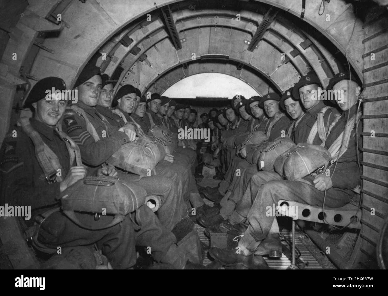Training Glider Pilots -- An interior view of a Horsa Glider with Airborne troops ***** either side all ready for towing. Britain is training glider pilots on a big scale in readiness for the Second Front. After pilots receive their initial training at an R.A.F. Glider School, they pass out at a heavy glider conversion unit. The function of the unit is to adapt pilots of the army airborne division to fly operational type of gliders, Horsas, after they have become proficient on the training type, Stock Photo
