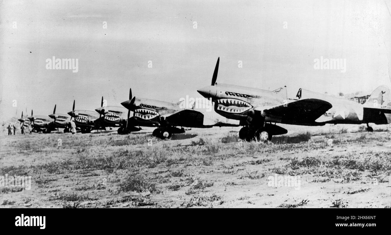 U.S. Airforce In China -- A flight of 'Flying Tiger' pursuit planes is lined up at a secret airfield 'somewhere in China' before taking off on a mission against the Japanese. The U.S. Army Air Forces, led by Brigadier General Claire L. Chennault of 'Flying Tiger' fame, have kept up their scoring record of eight Jap planes downed for each American loss. February 15, 1943. (Photo by Interphoto News Pictures, Inc.). Stock Photo