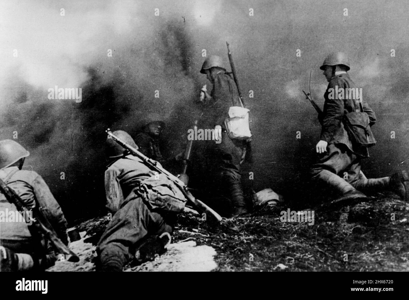 Red Army Mortars In Action -- Under cover of a smoke screen Soviet trench mortar gunners shell enemy positions. January 10, 1943. (Photo by Sport & General Press Agency, Limited). Stock Photo