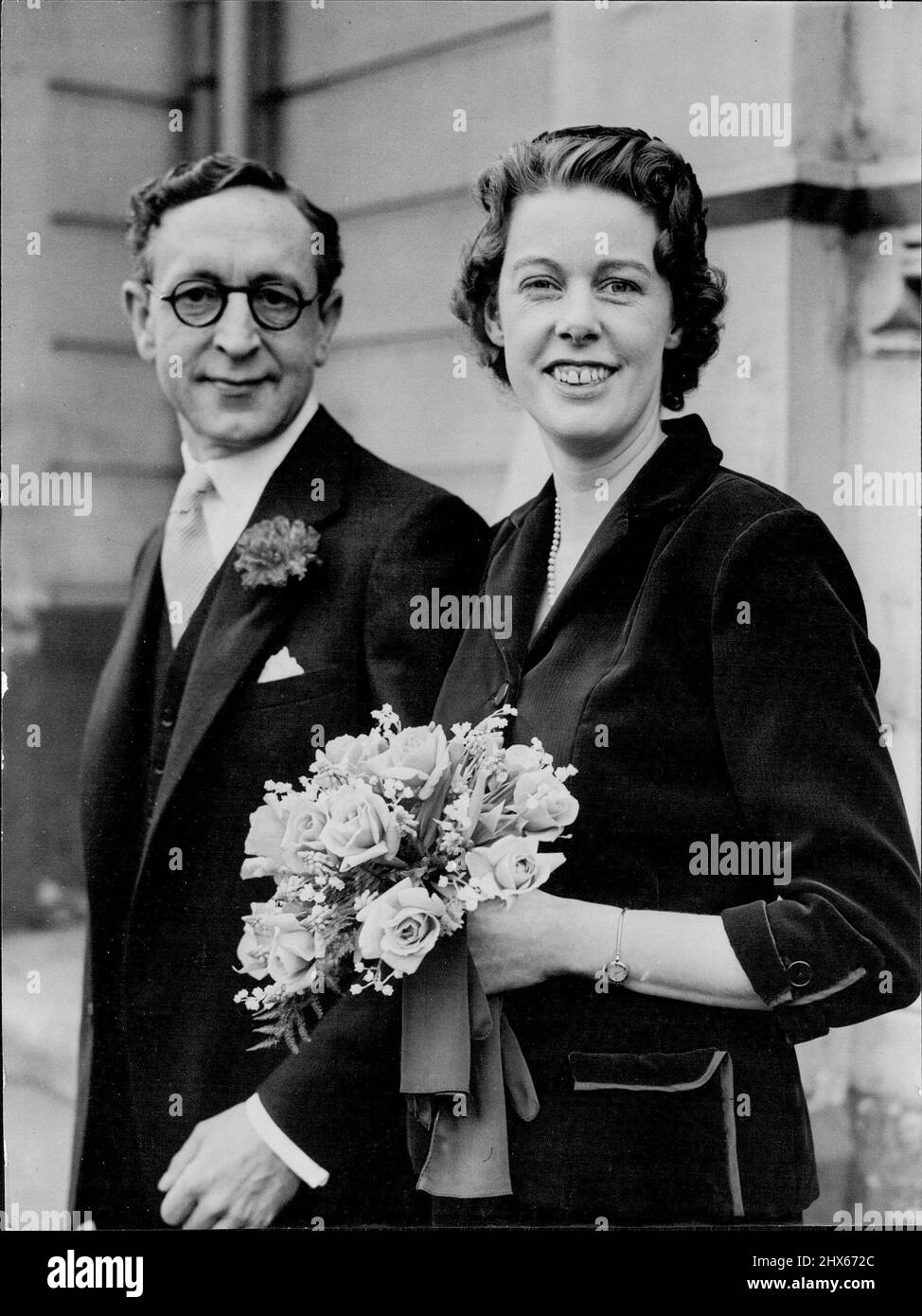 Composer Weds -- Mr. Charles Zwar, a composer of theatre music, youngest son of the late Mr. and Mrs. Charles Zwar of Broadford, Victoria, Australia, leaves the Church of St. George the Martyr, Queen Square, London, W.C., with his bride after their wedding to-day (Wednesday). She was Miss Diana Plankett, daughter of the late Brigadier Edward Plunkett and of Mrs. Plunkett of Chatsworth Court, Kensington, London. Miss Plunkett has been working on the administrative side of the theatre. December 21 Stock Photo