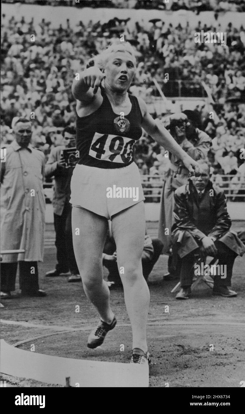 Olympic Games at Helsinki - Galina Zybina, of Russia, winning the putting the weight contest in the Olympic games at Helsinki. She created a world and Olympic record with 15.28 Metres (Approximately 50ft. 1½ in.). July 28, 1952. (Photo by Paul Popper). Stock Photo